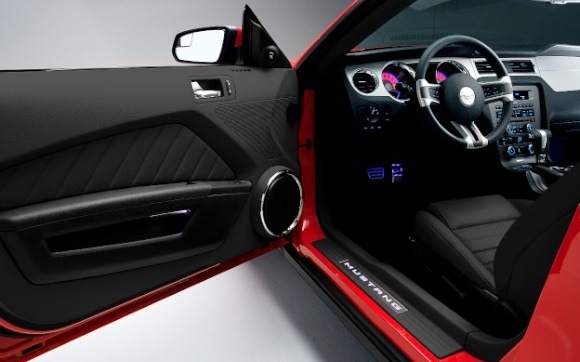 2011_mustang_ambiant Ambient lighting welcomes drivers with backlit Mustang lettering in the sill plate.