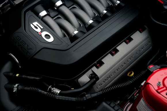 2011_mustang_engine 5.0-liter camshaft covers proudly proclaim, "Powered by Ford."